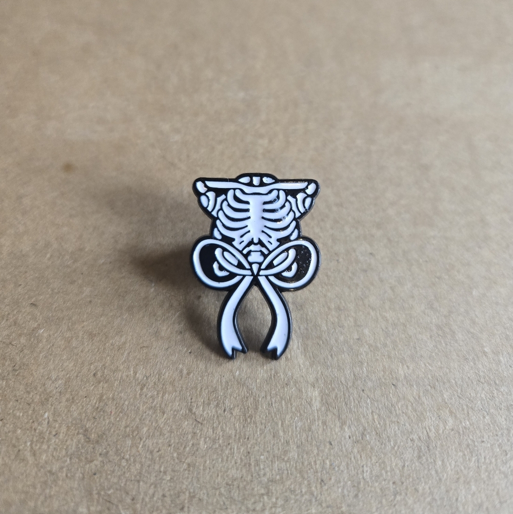 Skeleton Ribcage Bow Enamel Pin